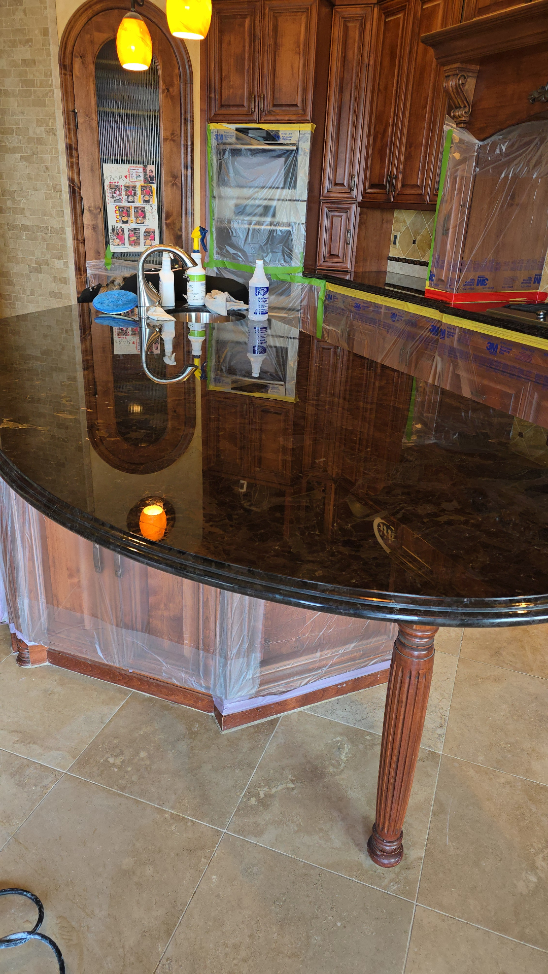 Dark granite kitchen island polishing and restoration in Arizona luxury home